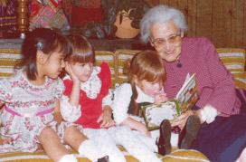 Pat's aunt reading to Pat's niece Niki and Pat's daughters Libby and Cissy