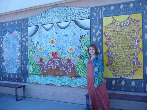 Pat Mora by the mural for The Desert is My Mother