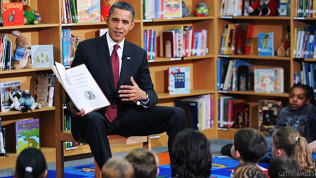ARLINGTON, VA - DECEMBER 17: U.S. President Barack Obama reads a book to second graders at Long Branch Elementary School December 17, 2010 in Arlington, Virginia. Obama is expected to sign the compromise $858 billion tax legislation later in the day. (Photo by Olivier Douliery-Pool/Getty Images)