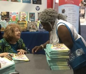 Pat signed copies of the book for librarians at ALA annual 2019.
